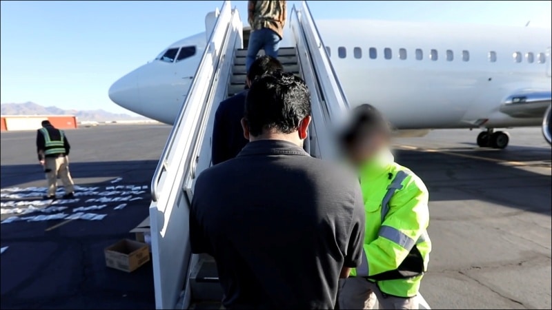 An ICE detainee boards a flight to Guatemala earlier this year. Deportation flights from the Los Angeles region have more than doubled recently. (DHS Video)
