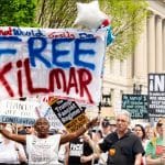 Protesters carry Free Kilmar banner at Washington DC march for Kilmar Abrego Garcia, April 2025