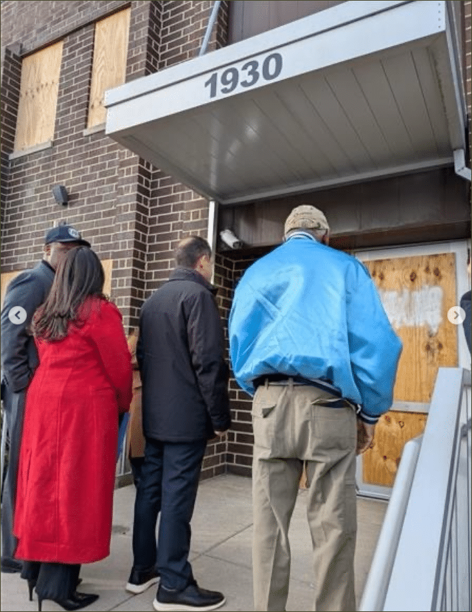 Four members of Congress entering Broadview ICE processing center in Illinois, boarded windows visible on either side of entrance