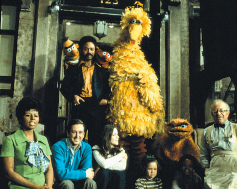 Original Sesame Street cast with Big Bird, Bert, Ernie, and human cast members on the stoop of 123 Sesame Street, 1969 promotional photo