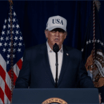President Donald Trump speaks at podium wearing USA cap while announcing military strikes against Iran from Mar-a-Lago, February 28, 2026
