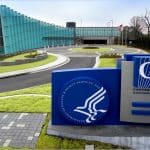 CDC headquarters entrance sign and Tom Harkin Global Communications Center building on the Atlanta campus