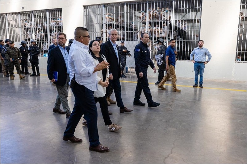Chilean President Jose Antonio Kast walks past crowded prison cells during a tour of CECOT mega-prison in El Salvador in January 2026