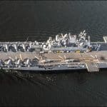 Aerial view of USS Tripoli LHA-7 with 20 F-35B Lightning II jets on flight deck