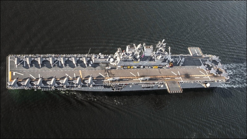 Aerial view of USS Tripoli LHA-7 with 20 F-35B Lightning II jets on flight deck