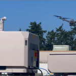 Portland Police Department surveillance drone in flight above east precinct rooftop, Portland, Oregon