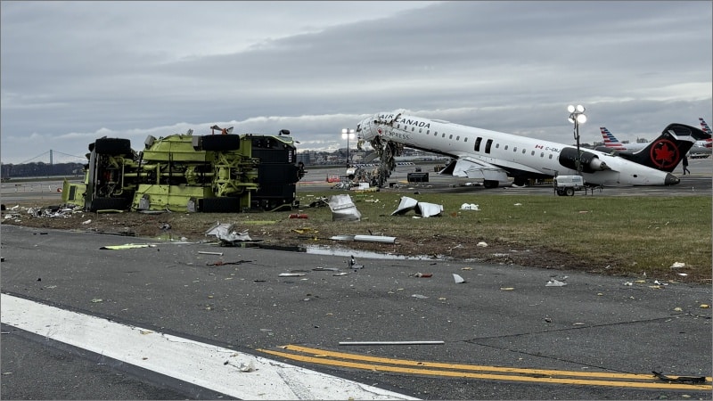 Wreckage of Air Canada Express jet and overturned fire truck on LaGuardia Runway 4 after fatal March 22 collision.
