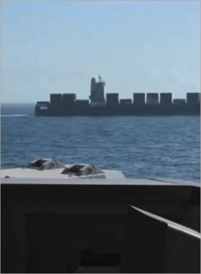 Iranian cargo ship Touska seen from U.S. Navy vessel in Gulf of Oman before being fired on and boarded April 19, 2026