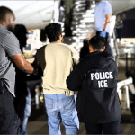 ICE officers escort detainee to deportation flight at Dallas airport