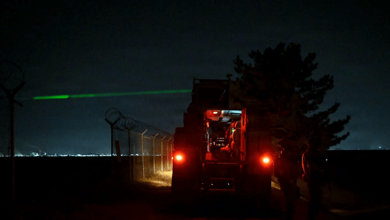 U.S. Air Force Zeus III high-energy laser fires at a drone target at night during Exercise Freedom Shield 26 at Kunsan Air Base, South Korea