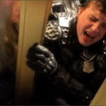 DC Metropolitan Police Officer Daniel Hodges crushed in a US Capitol doorway by rioters on January 6, 2021