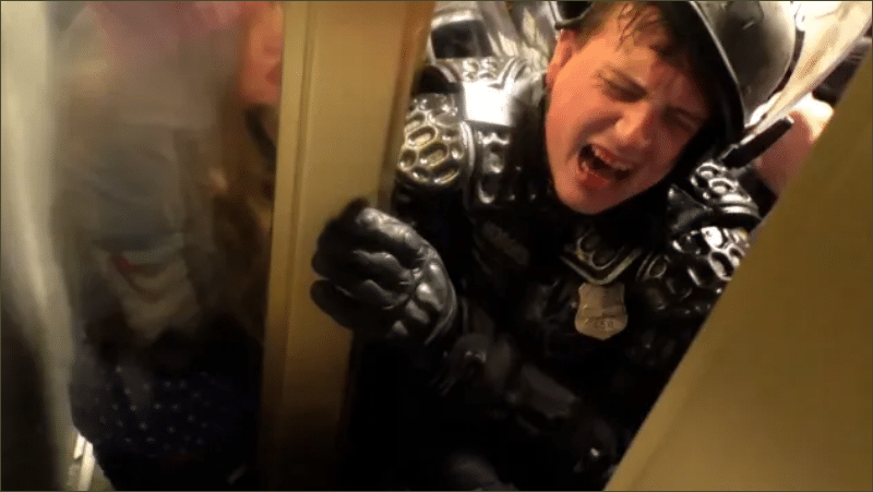 DC Metropolitan Police Officer Daniel Hodges crushed in a US Capitol doorway by rioters on January 6, 2021