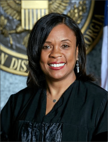 U.S. District Judge Eleanor L. Ross in her judicial robe before the seal of the Northern District of Georgia