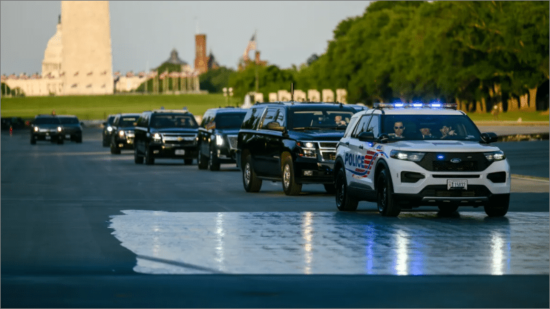 Trump motorcade driving through the drained Lincoln Memorial Reflecting Pool with the Washington Monument in the background