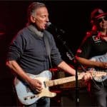 Bruce Springsteen and Tom Morello performing on stage at the Defend Minnesota benefit concert in Minneapolis