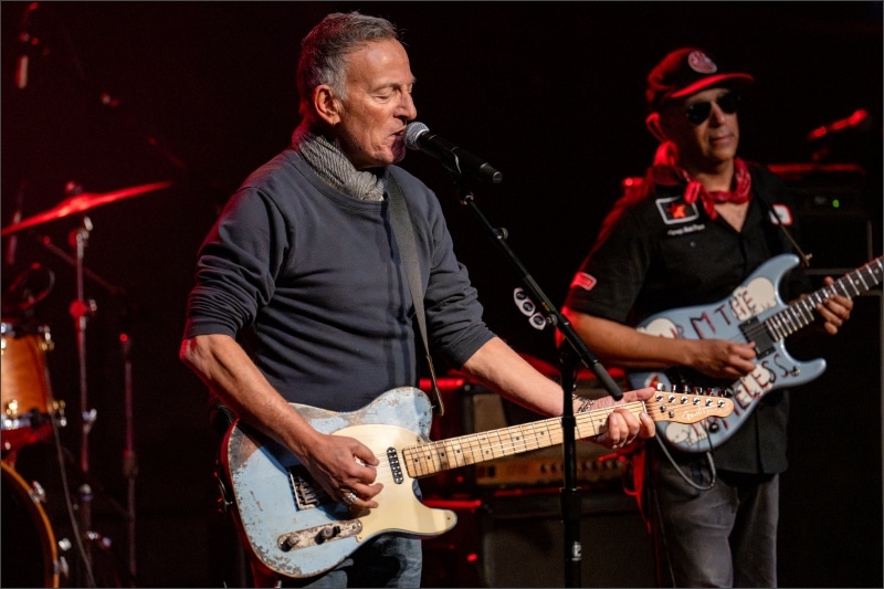 Bruce Springsteen and Tom Morello performing on stage at the Defend Minnesota benefit concert in Minneapolis
