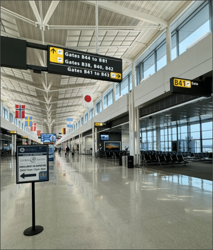 Dulles International Airport international concourse with global flags hanging from the ceiling