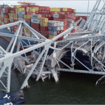 Aerial view of container ship Dali tangled in the collapsed Francis Scott Key Bridge, Baltimore, March 2024.