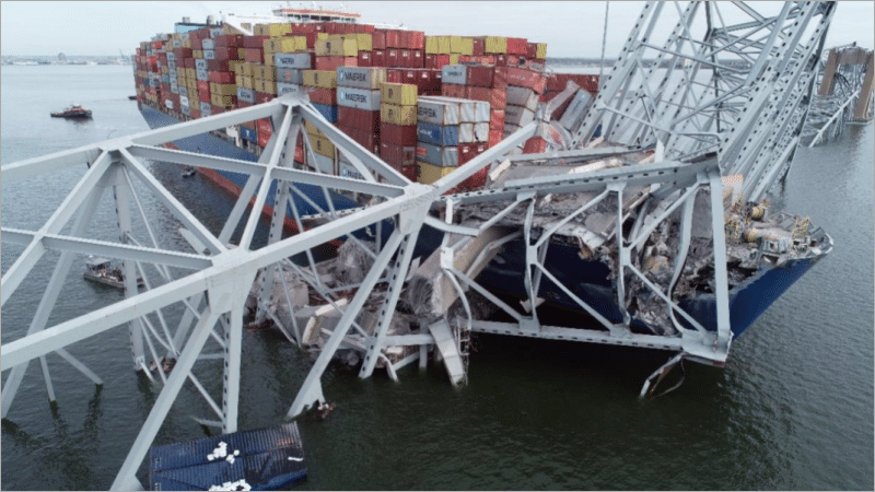 Aerial view of container ship Dali tangled in the collapsed Francis Scott Key Bridge, Baltimore, March 2024.