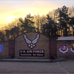 U.S. Air Force sign and unit shields at the Ramstein Air Base entrance in Germany at sunset