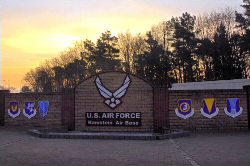 U.S. Air Force sign and unit shields at the Ramstein Air Base entrance in Germany at sunset