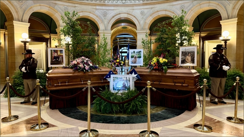 Caskets of Melissa Hortman and her husband Mark lying in state with honor guard in the Minnesota State Capitol rotunda