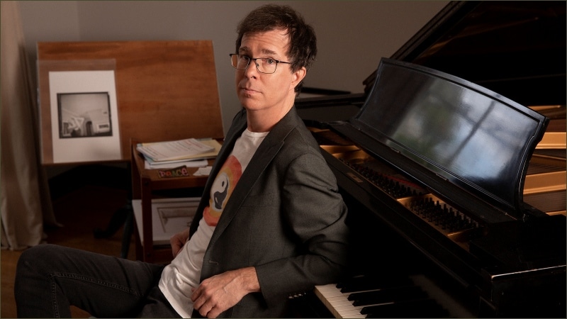 Ben Folds, former National Symphony Orchestra artistic adviser, seated beside a grand piano