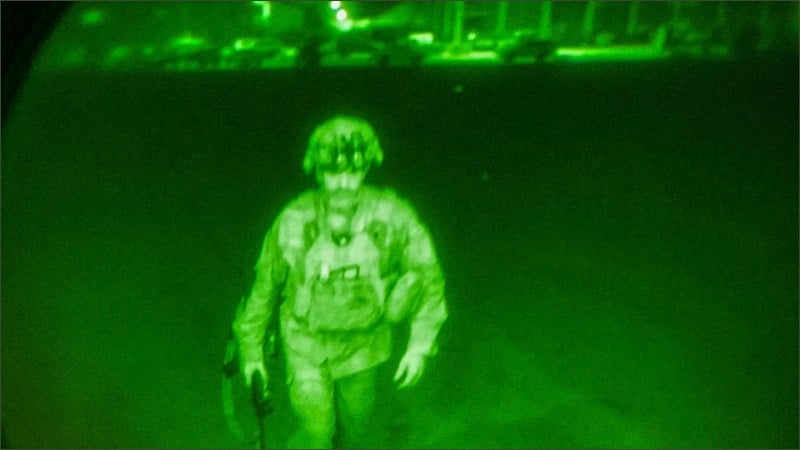 Green night-vision photo of Gen. Chris Donahue walking to a C-17, the last American soldier to leave Afghanistan, Kabul, 2021