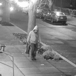 FBI surveillance still of a hooded, masked suspect carrying a bag along a dark Capitol Hill sidewalk on January 5, 2021, in the January 6 pipe bomb case