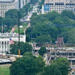 Aerial view of White House ballroom construction on the demolished East Wing site and a new helipad under construction on the South Lawn, July 2026