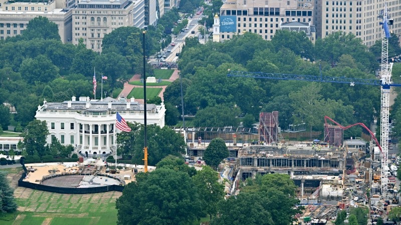 Aerial view of White House ballroom construction on the demolished East Wing site and a new helipad under construction on the South Lawn, July 2026