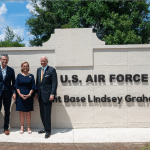 Treasury Secretary Scott Bessent, Defense Secretary Pete Hegseth, Sen. Darline Graham, and Gov. Henry McMaster stand at the new Joint Base Lindsey Graham sign in South Carolina.