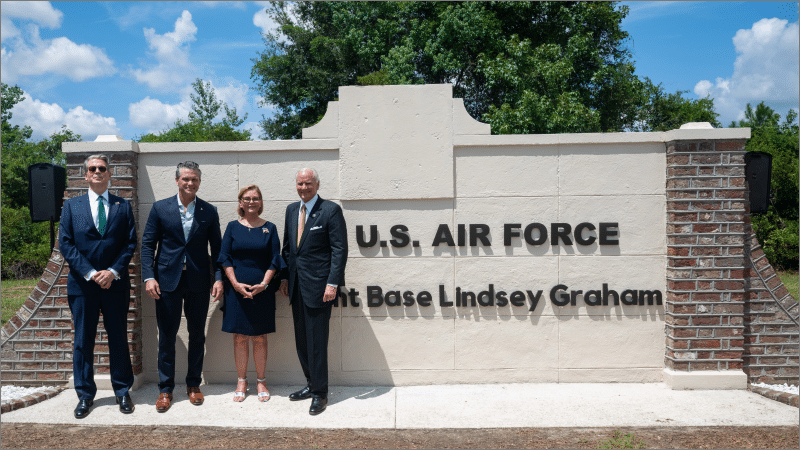 Treasury Secretary Scott Bessent, Defense Secretary Pete Hegseth, Sen. Darline Graham, and Gov. Henry McMaster stand at the new Joint Base Lindsey Graham sign in South Carolina.