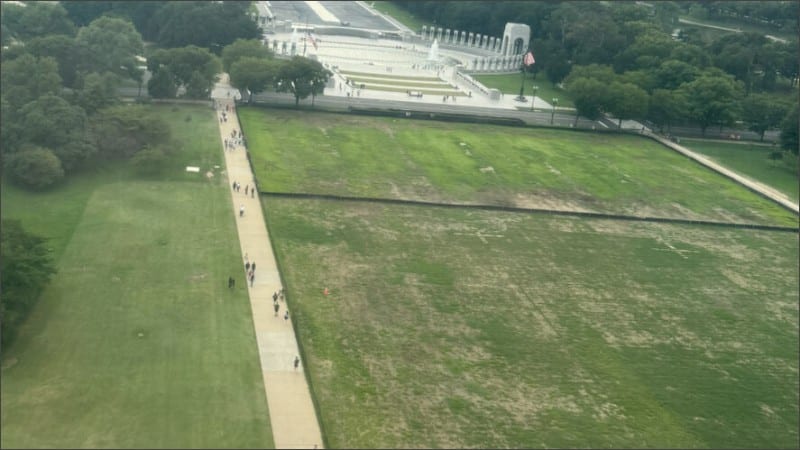 Aerial view of dead grass patches on the National Mall near the World War II Memorial in Washington