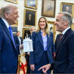 Trump shows Canadian Prime Minister Mark Carney a white model of his planned triumphal arch in the Oval Office