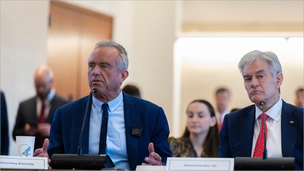 Health Secretary Robert F. Kennedy Jr. and CMS Administrator Mehmet Oz seated at a Healthcare Advisory Committee meeting
