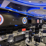 NSA National Security Operations Center watch floor at Fort Meade with monitors and agency seals