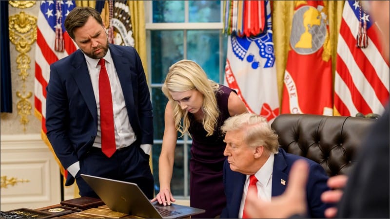 Natalie Harp leans over a laptop on Donald Trump's Oval Office desk while JD Vance looks on