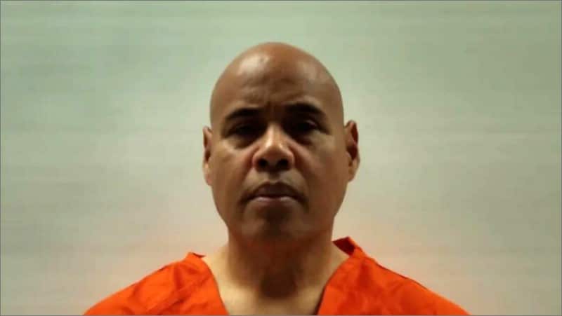 Booking photo of ICE agent Christian Castro in an orange jail uniform from the Cameron County Sheriff's Office