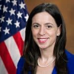 Official portrait of former Justice Department pardon attorney Liz Oyer in front of an American flag