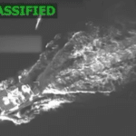 Still from Department of Defense surveillance video showing a US missile descending toward a boat in the Caribbean Sea