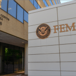 FEMA headquarters building at 500 C Street SW in Washington, DC, with the agency sign and Homeland Security seal