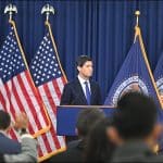 Federal Reserve Chair Kevin Warsh at the podium as reporters raise their hands at the FOMC press conference on September 16, 2026